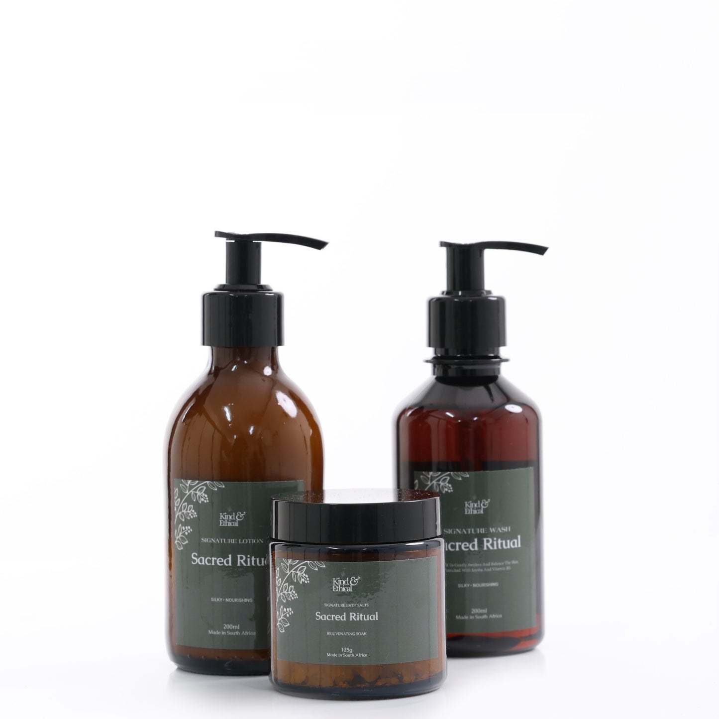 Three bottles of 'Sacred Ritual' products on a white background