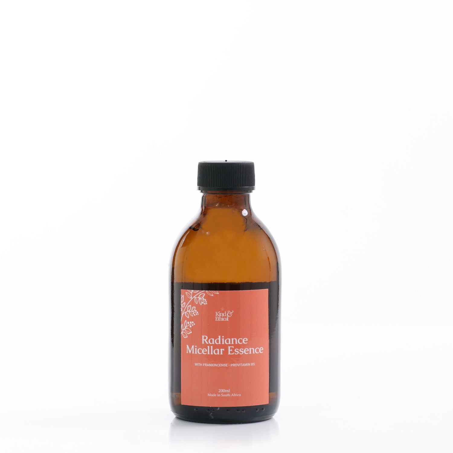 Amber glass bottle with a black cap labeled 'Radiance Micellar Essence' on a white background