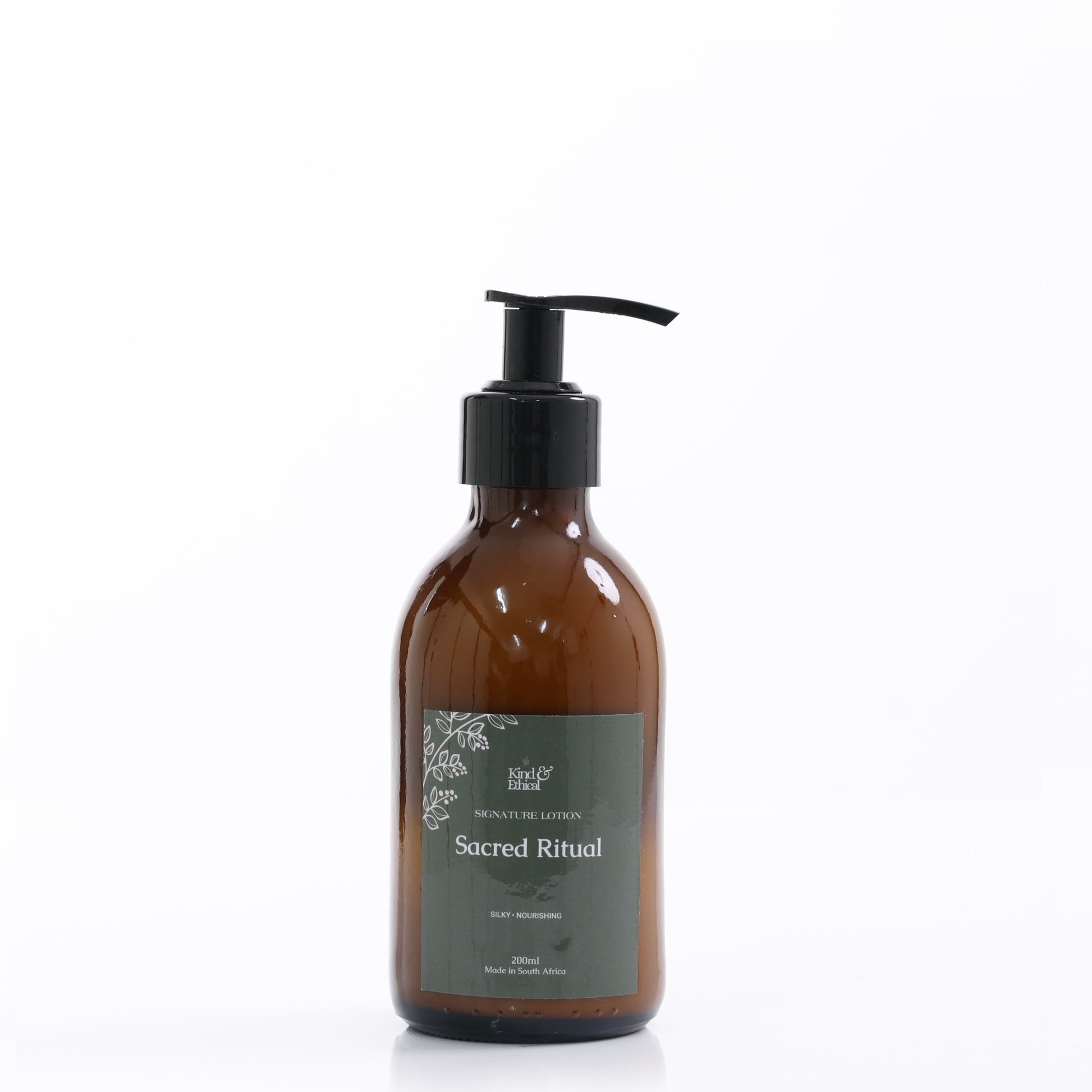 Brown bottle with pump labeled 'Sacred Ritual' on a white background