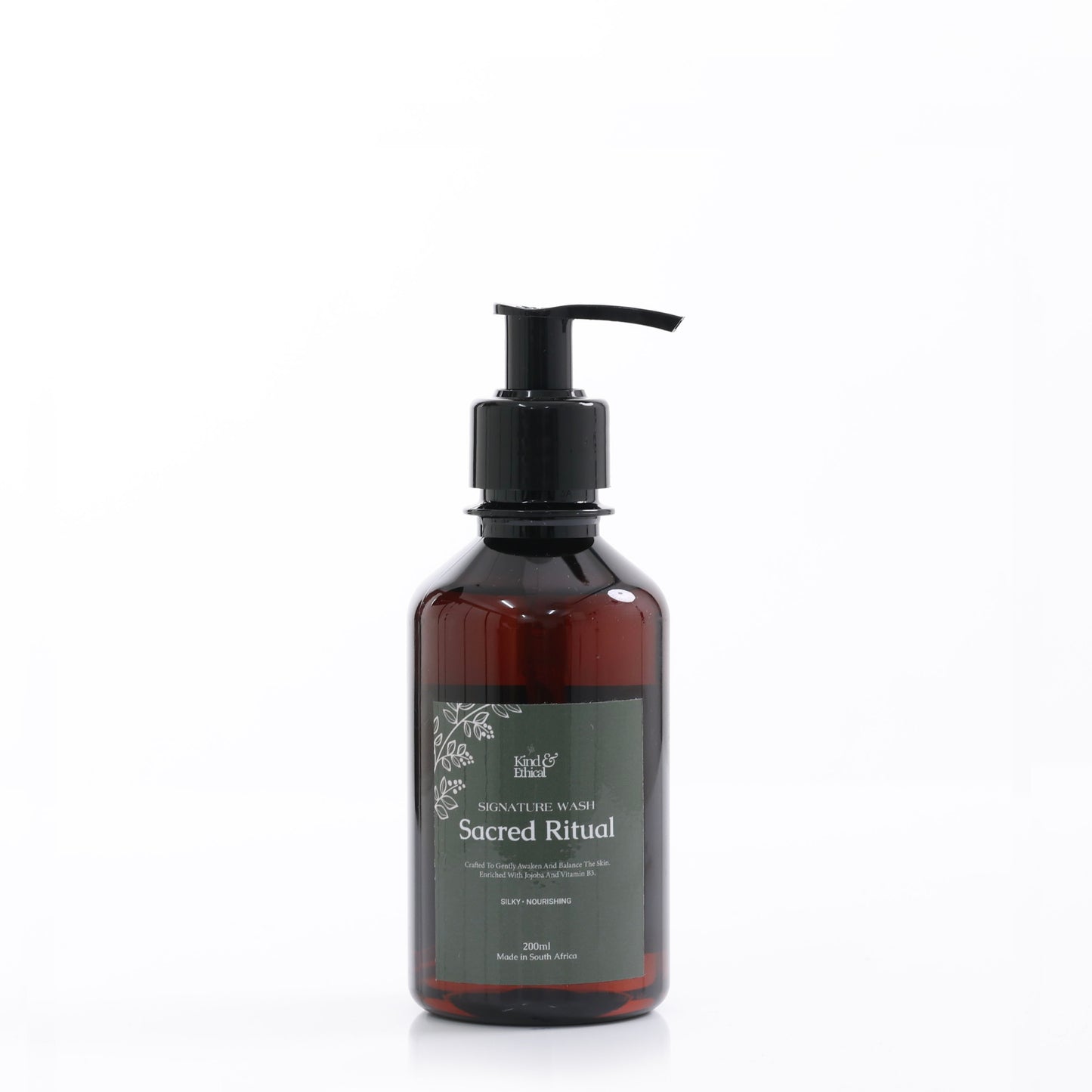 Brown body wash bottle with pump labeled 'Sacred Ritual' on a white background