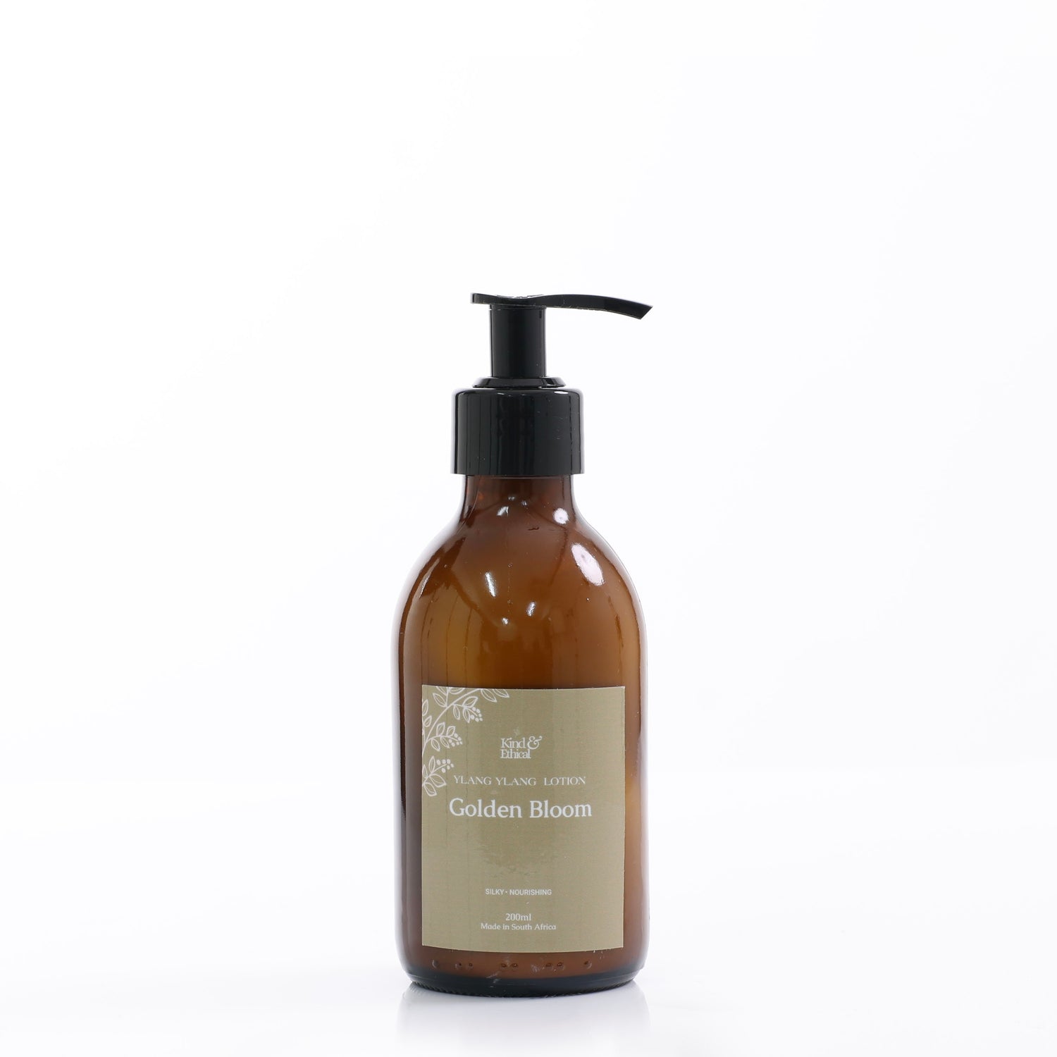 Brown Bottle with Pump and words Ylang Ylang Lotion on plain white background